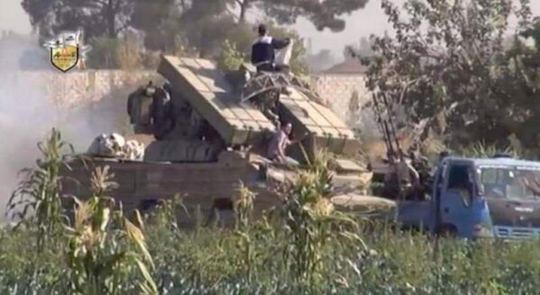 Military vehicle among buildings